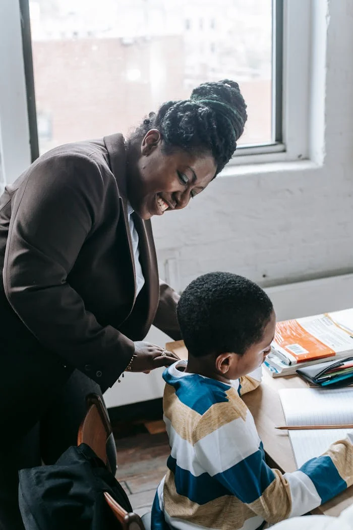 The Art of Drawing Readers In: Your attractive post title goes here High angle of smiling adult ethnic female tutor teaching attentive little boy solving task during lesson in classroom